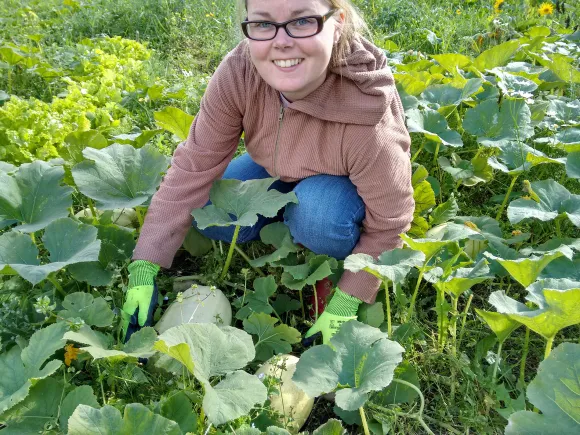 Lumia from Beyond Buckthorns permaculture in the garden Lumia Huhdanpää-Jais at the Beyond Buckthorns permaculture homestead showing squash